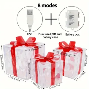 Detailansicht von 3 leuchtenden Geschenkschachteln mit roten Schleifen und USB Batteriebox.