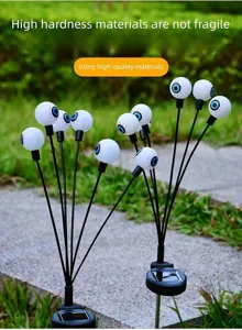 Halloween solar eyeball garden lights, spooky LED yard stakes for outdoor party decoration.