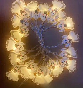Halloween ghost string light detail showing glowing white LED ghosts with cute faces.
