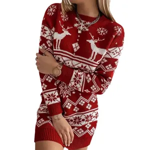 Close up view of red Christmas knitted sweater dress featuring white deer and snowflake patterns.