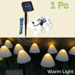 Solar powered LED mushroom string lights for outdoor garden decoration, waterproof warm lighting.