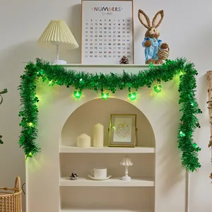 St. Patrick's Day green tinsel garland with light-up clover LED string for indoor holiday decor.