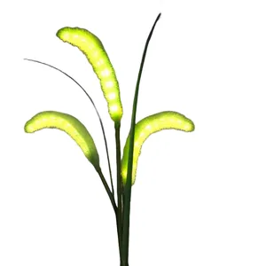 Solar LED foxtail grass outdoor garden light with glowing green fuzzy spikes for lawn decor.