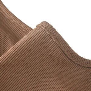 Close-up detail of women's ribbed sleeveless bodysuit texture, soft and stretchy fabric.