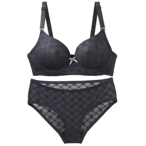 Black lingerie set for women featuring push-up bra and matching panties with stylish pattern.