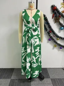 Sleeveless V-neck maxi dress with chic green and white abstract print, slim waist and flare hem.