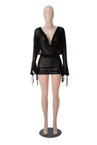 Sexy black sheer mesh long sleeve top and ruched bodycon mini skirt detail view.