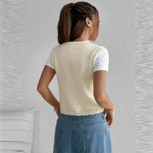 Back detail view of casual beige knitted vest layered over a white t-shirt, stylish and cozy.