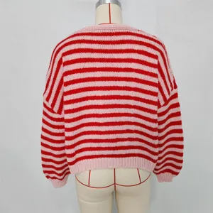 Red and pink striped knit sweater detail, showing back view and texture craftsmanship.