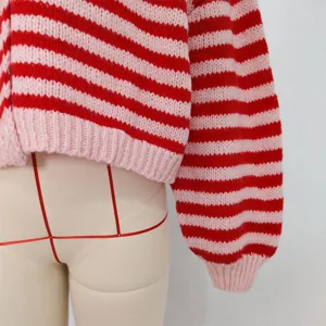 Red pink striped knit cardigan sweater detail view, cozy long sleeve V-neck top for women.