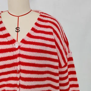 Close-up of red and pink striped knit cardigan, V-neck design, casual long sleeve.