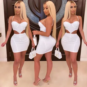Detail view of the stylish white crop top and mini skirt set, showcasing fit and design.