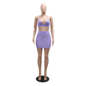Detail view of the purple sequin two-piece set featuring a spaghetti strap crop top and mini skirt.
