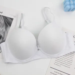 Detailed view of the white lace breathable plus size women push up bra with delicate charm.