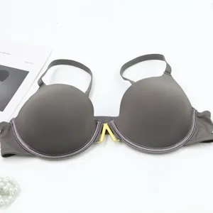 Close up detail of grey seamless padded bra featuring elegant front metal V hardware accent.