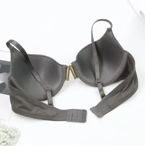 Seamless grey push-up bra with front V metal buckle, underwire, and adjustable straps.