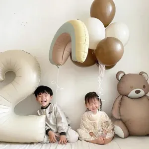 Close-up of matte bear and rainbow foil balloons in retro Korean style for party decor