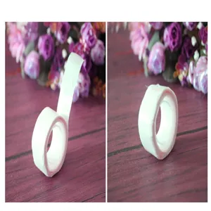 Macro detail view of double-sided adhesive balloon glue dots roll for party wedding decorations