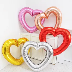 Giant heart-shaped foil balloon frames for party decorations and photo booth props.