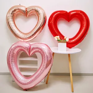 Large hollow heart foil balloons in rose gold red and pink for romantic party decorations