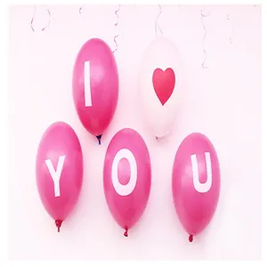 Detail of pink balloons spelling 'I Love You' for wedding and party decorations