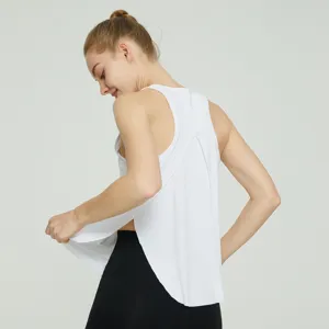 White sleeveless yoga tank top for women, featuring open back and split hem design.