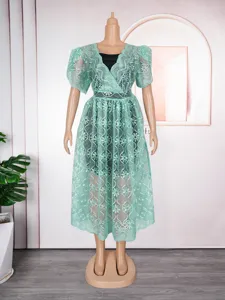 Elegant mint green lace hollow V-neck dress two-piece set, perfect for chic summer wear.