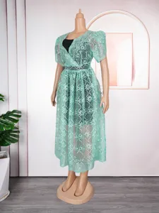Plus size mint green lace hollow V-neck dress set, elegant two-piece women's apparel.