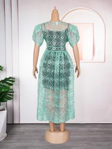 Detailed view of the mint green lace hollow short-sleeve dress and slip two-piece set.