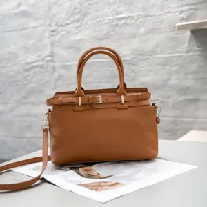 Genuine leather tote bag for women, stylish brown top-handle crossbody handbag with belt detail.