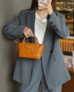 Retro genuine leather dumpling handbag for women, versatile top-layer cowhide mini crossbody bag.
