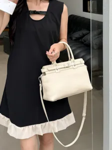 Genuine leather Kelly tote bag for women, stylish crossbody handbag with top handle and strap.