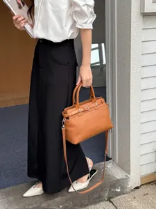 Stylish genuine leather top handle tote bag for women, large capacity crossbody handbag with strap.
