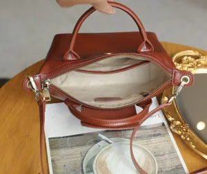 Genuine leather dumpling handbag, retro versatile crossbody bag with top handle interior.