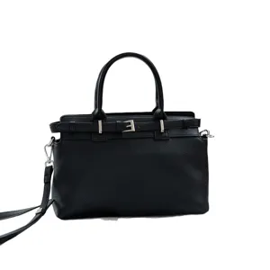 Black leather Kelly tote bag for women, stylish top handle handbag with crossbody strap.