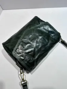 Vintage dark green leather crossbody bag detail, genuine cowhide envelope shoulder bag.