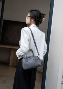 Detailed view of the soft genuine leather Boston bag, versatile shoulder and crossbody design.