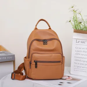 Large capacity genuine leather backpack for women, stylish commuter travel bag brown.