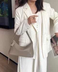 Elegant genuine leather underarm bag for women, premium French style shoulder handbag.