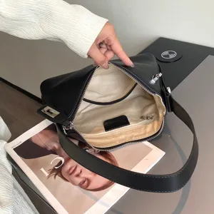 Black genuine leather hobo shoulder bag detailed interior view with soft lining and smooth zipper.