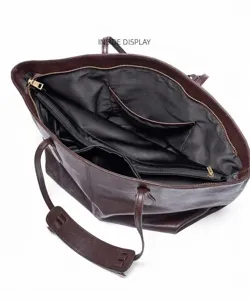 Brown leather tote bag interior view showing spacious multi-compartment design details