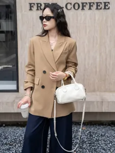 Stylish white leather Boston handbag for women, versatile top-handle shoulder and crossbody bag.