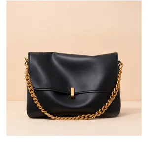 Black leather shoulder bag with gold chain strap, large capacity commuter handbag for women.