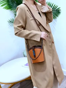 Genuine leather women bucket bag with chain strap, stylish crossbody handbag for daily use.