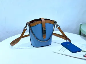 Stylish contrast color genuine leather bucket bag with metal chain strap and twist lock for women
