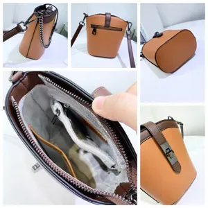 Close-up details of leather bucket bag showing interior compartments, lock closure, and chain strap.