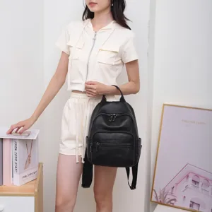 Black leather backpack for women, large capacity commuter travel bag with multiple zipper pockets.