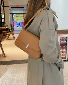 Stylish genuine leather underarm shoulder bag for women, classic brown minimalist daily purse.