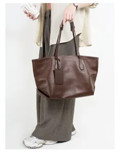 Leather tote bag detail view, large capacity brown shoulder bag for women commuting daily.