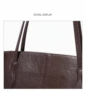 Brown leather tote bag detail showcasing fine stitching and premium texture for daily commute use.
